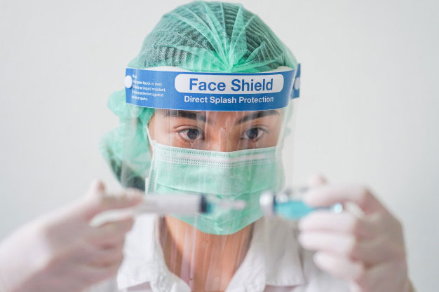 Doctor in face shield and face mask